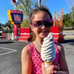 young-girl-holding-huge-ice-cream-cone